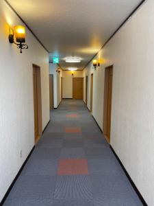 an empty hallway in an office building at NAEBA Country Lodge in Yuzawa