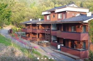 a house in the middle of a forest at Moon-hyo House 1 in Boryeong