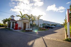 a street with a building on the side of a road at Hotel Santa Barbara Miyakojima Resort in Miyako-jima