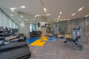 a gym with several treadmills and cardio machines at Somerset Central Salcedo Makati in Manila
