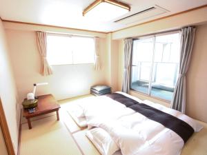 Postel nebo postele na pokoji v ubytování Hotel Abest Kochi