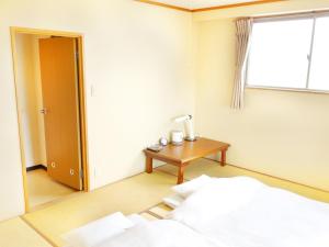 Postel nebo postele na pokoji v ubytování Hotel Abest Kochi