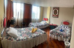 Postel nebo postele na pokoji v ubytování Hostal Jora Continental