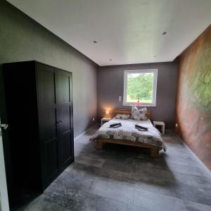 Llit o llits en una habitació de Ferienwohnung am Kupferbach