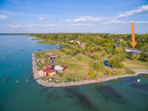 an aerial view of an island in the water at Sóstói Strand Apartmanház in Siófok