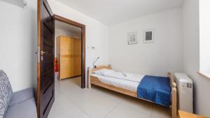 Łóżko lub łóżka w pokoju w obiekcie Apartamenty Sun & Snow Lido Sarbinowo