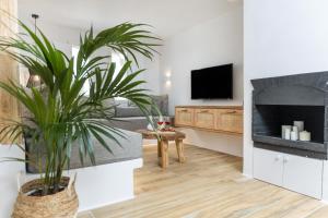Televízia a/alebo spoločenská miestnosť v ubytovaní Naxian Icon Luxury Residence 3