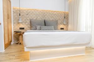 Posteľ alebo postele v izbe v ubytovaní Naxian Icon Luxury Residence 3