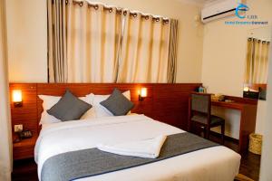 Postel nebo postele na pokoji v ubytování Hotel Dreams connect GRB