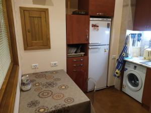 Η κουζίνα ή μικρή κουζίνα στο Republic square apartment