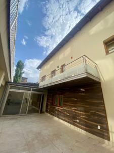 a balcony on the side of a building with a patio at Sarajevo city rent in Sarajevo