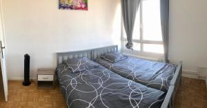 Posteľ alebo postele v izbe v ubytovaní Appart Gare TGV vue panoramique sur la ville