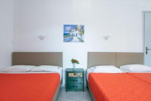 two beds sitting next to each other in a room at Anastasia's House in Toroni