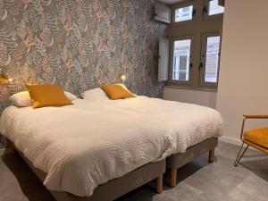 Posteľ alebo postele v izbe v ubytovaní Le Loft de l'hôtel Dieu
