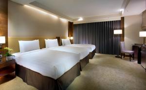 Ένα ή περισσότερα κρεβάτια σε δωμάτιο στο Hù House - Taipei