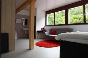 Voodi või voodid majutusasutuse L'auberge de Noiraigue toas