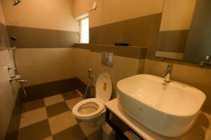 Koupelna v ubytování Coastal Pearl Hotel Miramar Panaji