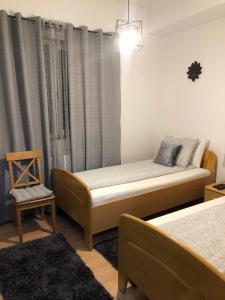 Ένα ή περισσότερα κρεβάτια σε δωμάτιο στο Apartament BAȘAK 2