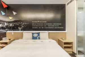 Postel nebo postele na pokoji v ubytování CU Hotel Taipei