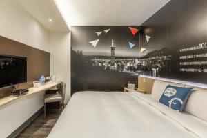 Postel nebo postele na pokoji v ubytování CU Hotel Taipei