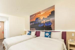 Postel nebo postele na pokoji v ubytování CU Hotel Taipei
