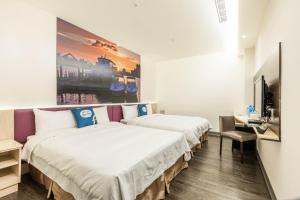 Postel nebo postele na pokoji v ubytování CU Hotel Taipei