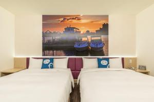 Postel nebo postele na pokoji v ubytování CU Hotel Taipei