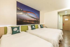 Postel nebo postele na pokoji v ubytování CU Hotel Taipei
