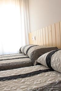 Postel nebo postele na pokoji v ubytování Apartamentos Las Casitas de El Blasón