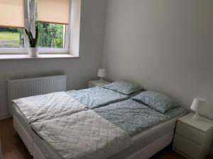 Posteľ alebo postele v izbe v ubytovaní Mazurski Dom