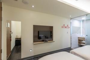 TV a/nebo společenská místnost v ubytování CU Hotel Taipei
