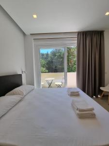 Кровать или кровати в номере Marea Retreat Rooms