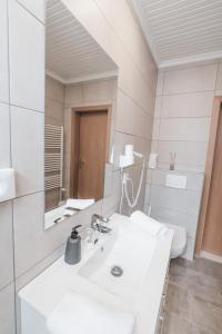 Koupelna v ubytování Hotel Aurora