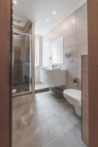 Koupelna v ubytování Hotel Aurora