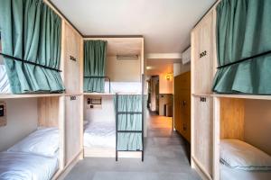 a room with four bunk beds in it at The Bee Hostel in Amsterdam +24 photos