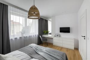 Posteľ alebo postele v izbe v ubytovaní Apartamenty Rodzinne Zdrojowe