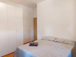 Postel nebo postele na pokoji v ubytování Genova Rooms Serra C
