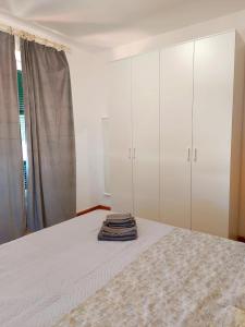 Postel nebo postele na pokoji v ubytování Genova Rooms Serra C