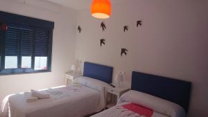 A bed or beds in a room at Cantos do Coido