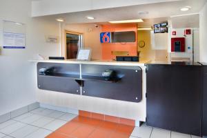 a kitchen with a sink in a restaurant at Motel 6-Galveston, TX in Galveston