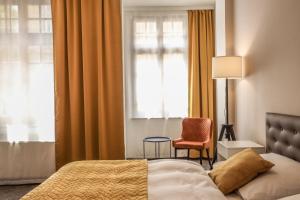 Postel nebo postele na pokoji v ubytování Hotel Pilgrim