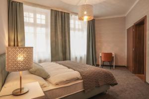 Postel nebo postele na pokoji v ubytování Hotel Pilgrim