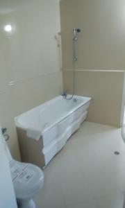 a bathroom with a tub and a toilet and a sink at Apartment 54 Ryor in Sunny Beach +4 photos