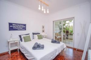 Ένα ή περισσότερα κρεβάτια σε δωμάτιο στο Amazing Family House with Swimming Pool