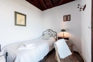 Un pat sau paturi într-o cameră la El Rincón