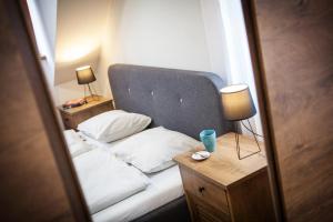 Posteľ alebo postele v izbe v ubytovaní Zaži Apartmány Mýto pod Ďumbierom