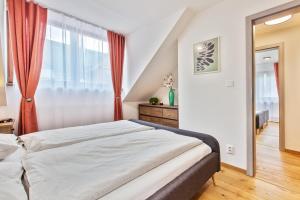 Posteľ alebo postele v izbe v ubytovaní Zaži Apartmány Mýto pod Ďumbierom