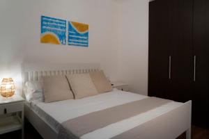 Postel nebo postele na pokoji v ubytování Le Meraviglie del Conero