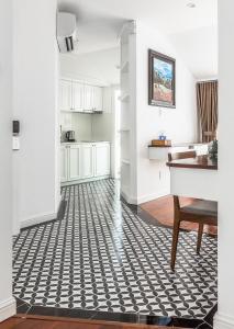 a living room with a black and white floor at Ngan Ha 2 Apartments in Ho Chi Minh City