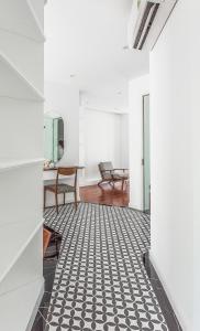 a hallway with a black and white tiled floor at Ngan Ha 2 Apartments in Ho Chi Minh City